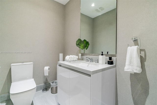 16901 Collins Ave Unit 1503, Sunny Isles Beach, FL 33160 - bathroom with vanity, toilet, and baseboards