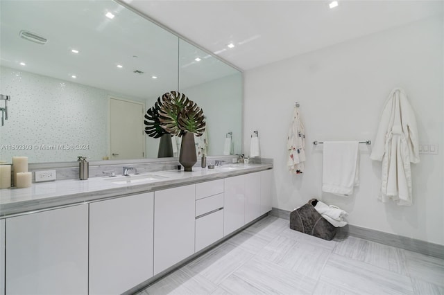 bathroom with vanity and backsplash