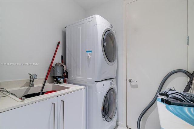16901 Collins Ave Unit 1503, Sunny Isles Beach, FL 33160 - laundry room with cabinet space and estacked washer and dryer