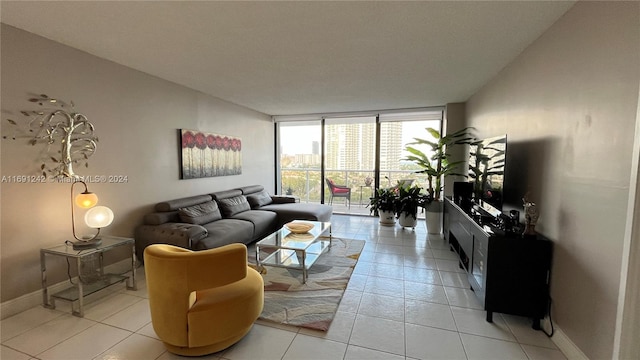 3731 N Country Club Dr Unit 1121, Aventura, FL 33180 - living area with expansive windows, light tile patterned floors, and baseboards