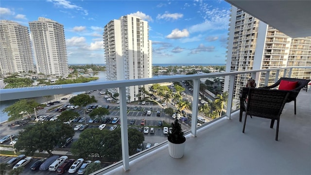 balcony featuring a water view