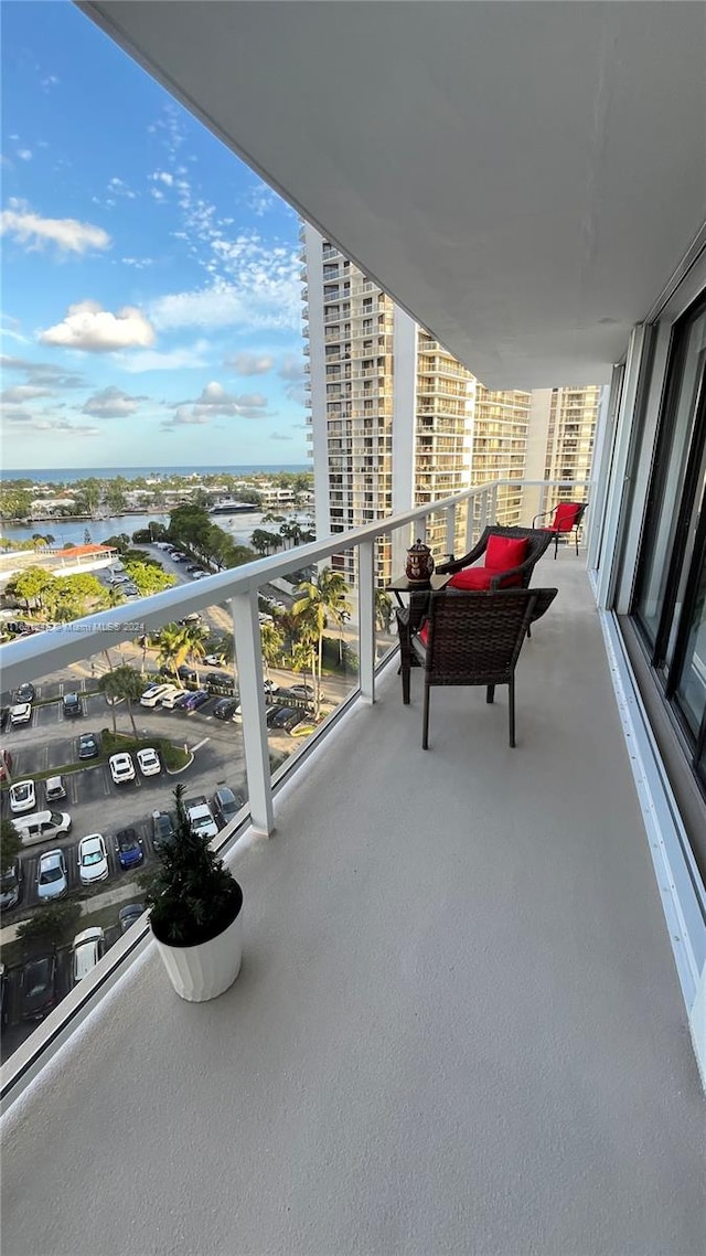 balcony featuring a water view