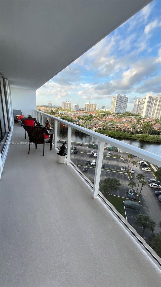 balcony featuring a water view