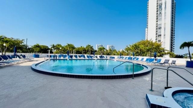 view of swimming pool featuring a patio area