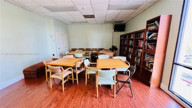 3731 N Country Club Dr Unit 1121, Aventura, FL 33180 - dining space with wood finished floors, a paneled ceiling, and baseboards