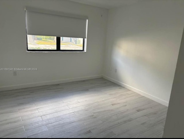 unfurnished room featuring light hardwood / wood-style flooring