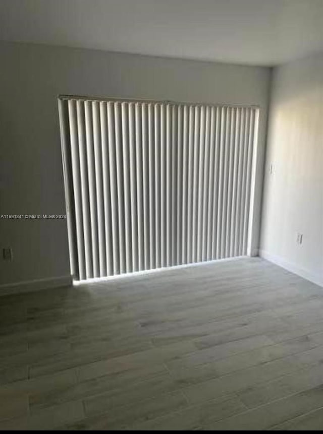 empty room featuring hardwood / wood-style flooring