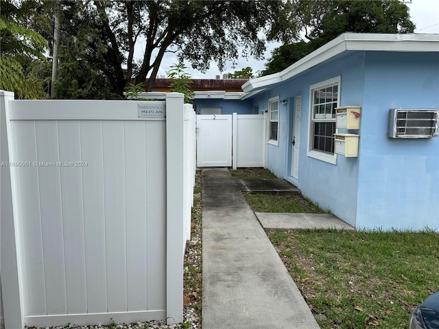 view of side of property with a wall unit AC