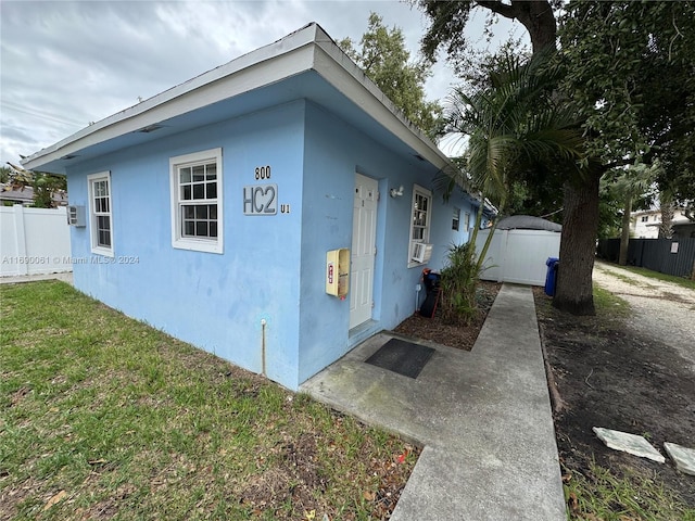 view of side of home featuring a yard