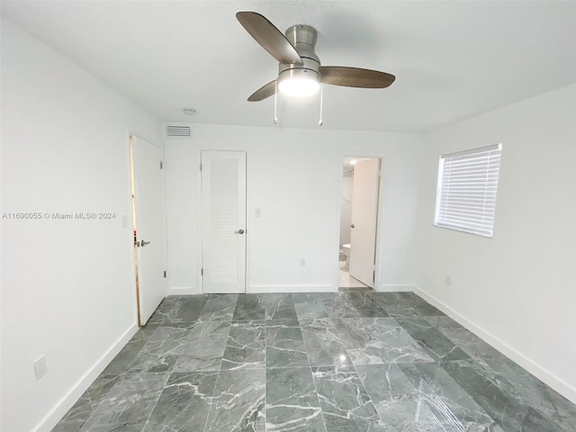 unfurnished room featuring ceiling fan