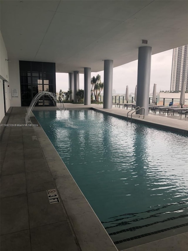 view of pool featuring pool water feature