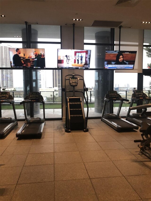 exercise room with expansive windows and plenty of natural light