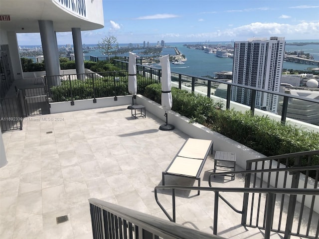 exterior space featuring a water view and a balcony