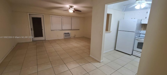 kitchen with light tile patterned floors, white appliances, a wall mounted air conditioner, and ceiling fan