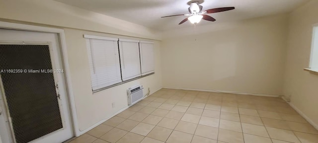 unfurnished bedroom with light tile patterned flooring, ceiling fan, and a wall mounted AC