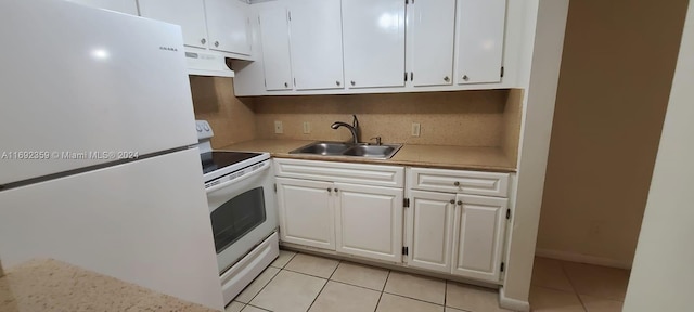 kitchen featuring white cabinets, sink, light tile patterned floors, custom range hood, and white appliances