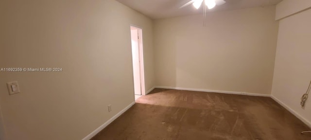 carpeted empty room featuring ceiling fan