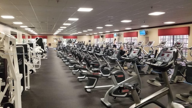 exercise room with a paneled ceiling