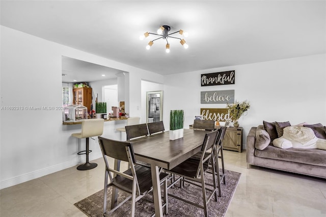 dining area featuring an inviting chandelier