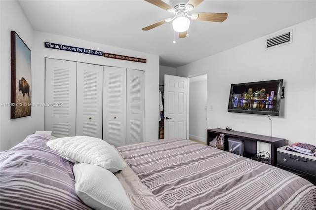 bedroom with ceiling fan and a closet