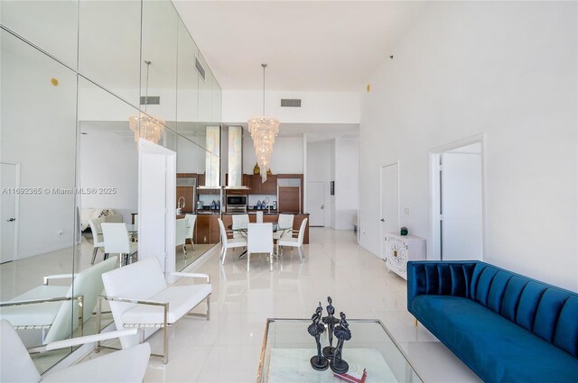 495 Brickell Ave Unit 4103, Miami, FL 33131 - living room with a chandelier and light tile patterned flooring
