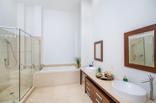 495 Brickell Ave Unit 4103, Miami, FL 33131 - full bath with a shower stall, a bath, double vanity, and tile patterned flooring