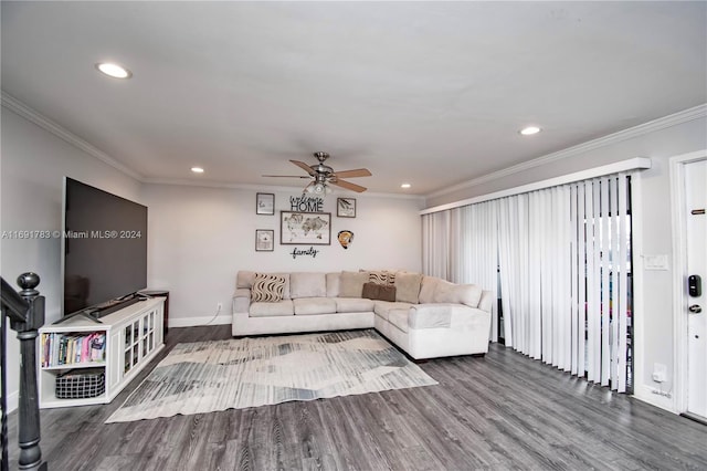 living room with hardwood / wood-style floors, ceiling fan, and crown molding