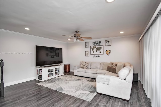 living room with ceiling fan, crown molding, and dark wood-type flooring