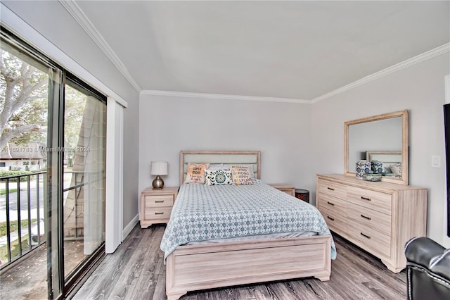 bedroom with access to exterior, wood-type flooring, and ornamental molding