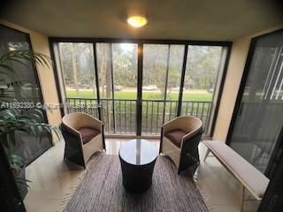 sunroom / solarium featuring a wealth of natural light