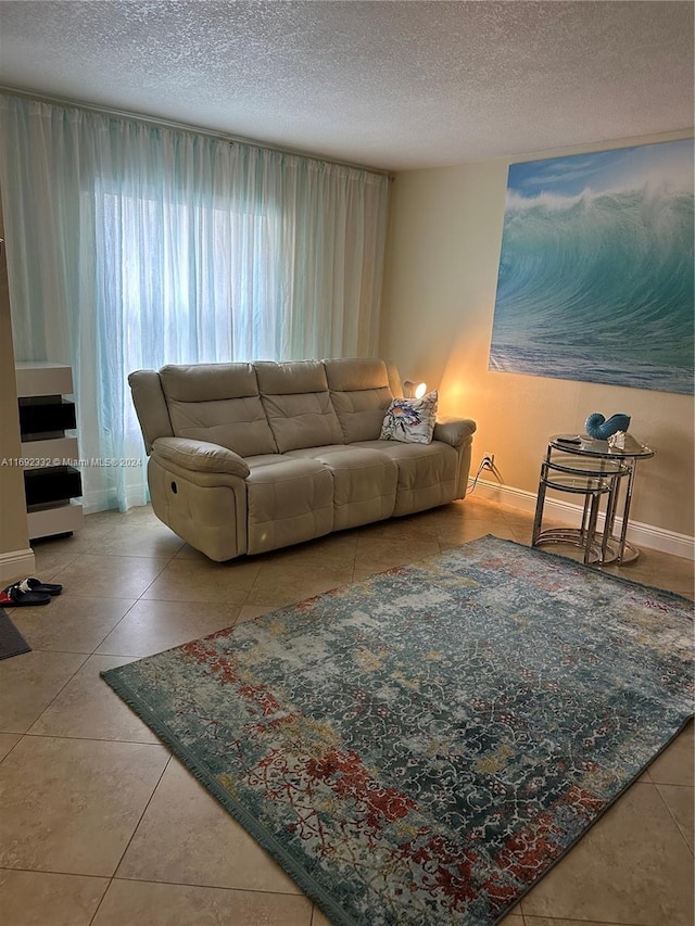 tiled living room with a textured ceiling