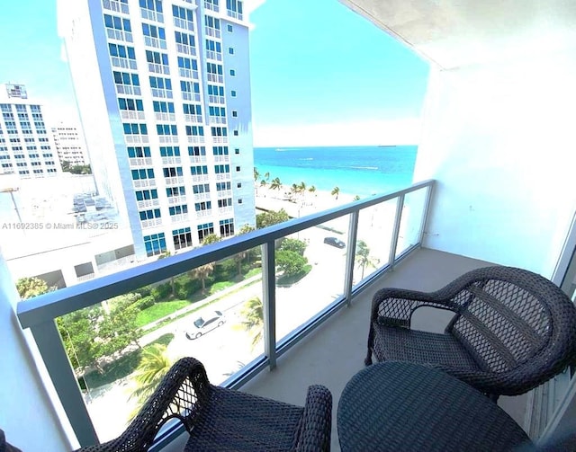 balcony featuring a water view