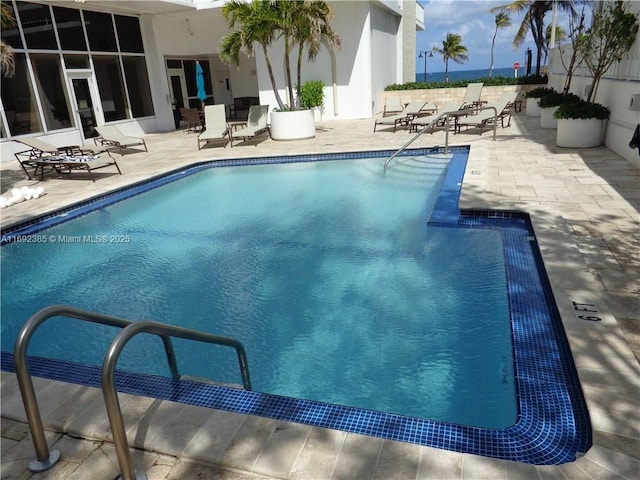 view of pool featuring a patio