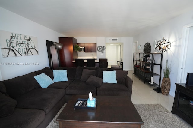 209 N Fort Lauderdale Beach Blvd Unit 7D, Fort Lauderdale, FL 33304 - living room featuring light tile patterned floors