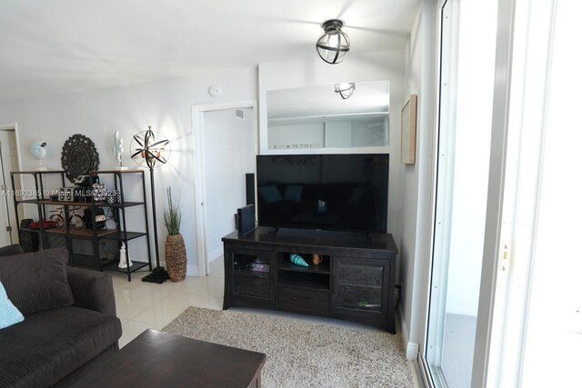 209 N Fort Lauderdale Beach Blvd Unit 7D, Fort Lauderdale, FL 33304 - living room with tile patterned floors and baseboards