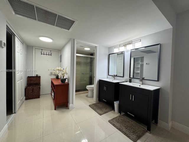 bathroom with an enclosed shower, vanity, tile patterned flooring, and toilet