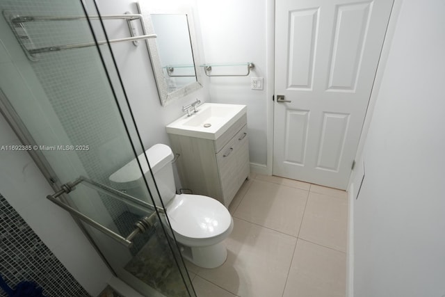 209 N Fort Lauderdale Beach Blvd Unit 7D, Fort Lauderdale, FL 33304 - full bathroom featuring tile patterned flooring, toilet, a stall shower, and vanity
