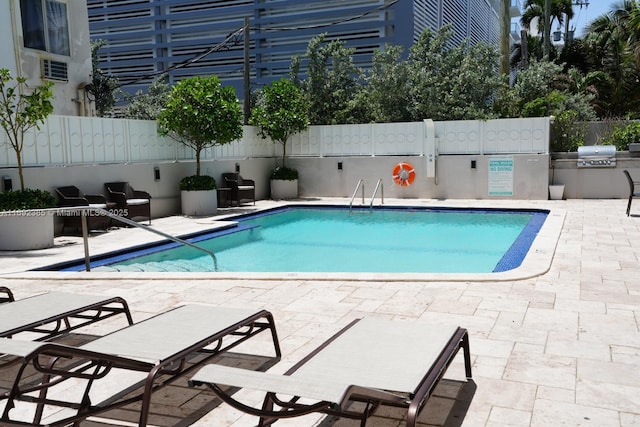 209 N Fort Lauderdale Beach Blvd Unit 7D, Fort Lauderdale, FL 33304 - community pool with grilling area, fence, and a patio area