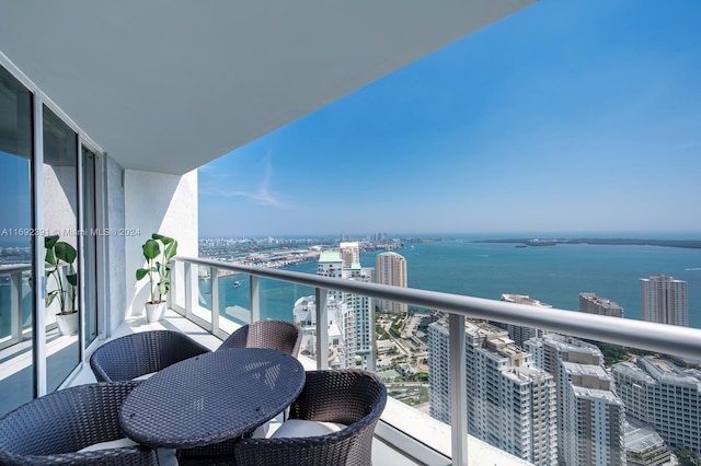 balcony featuring a water view