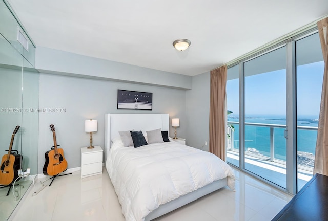 tiled bedroom with access to exterior, expansive windows, and a water view