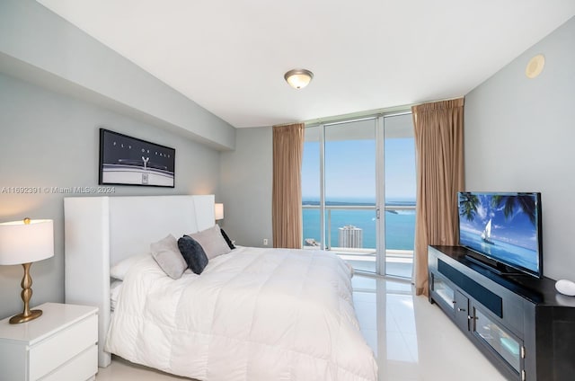 bedroom featuring access to outside and expansive windows