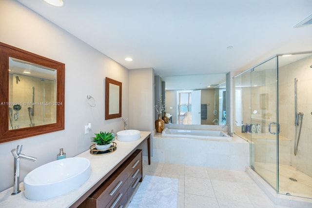 bathroom with vanity, plus walk in shower, and tile patterned flooring