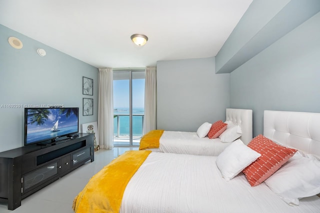 465 E Brickell Ave Unit 5305, Miami, FL 33131 - tiled bedroom featuring access to exterior and a wall of windows
