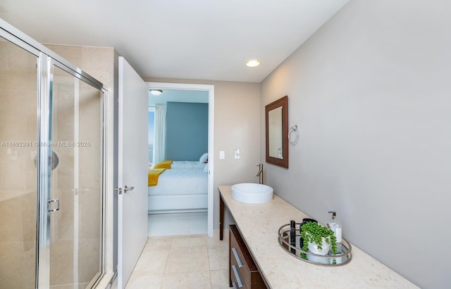 465 E Brickell Ave Unit 5305, Miami, FL 33131 - bathroom with ensuite bath, a stall shower, double vanity, recessed lighting, and tile patterned flooring