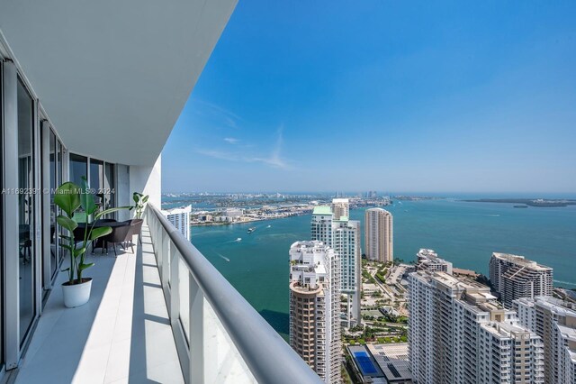 balcony featuring a water view