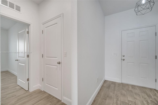 corridor featuring light hardwood / wood-style flooring