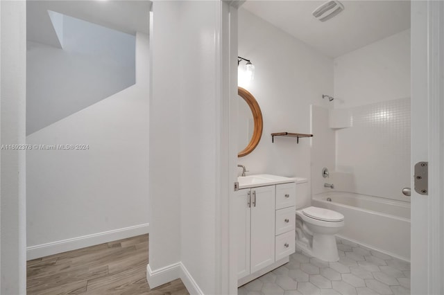 full bathroom with shower / bathing tub combination, vanity, tile patterned floors, and toilet