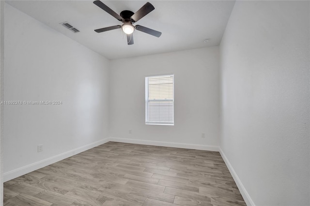 empty room with light hardwood / wood-style flooring and ceiling fan