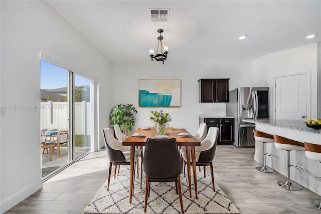 dining room featuring a chandelier and light hardwood / wood-style floors