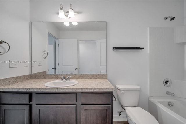 full bathroom with tub / shower combination, vanity, and toilet